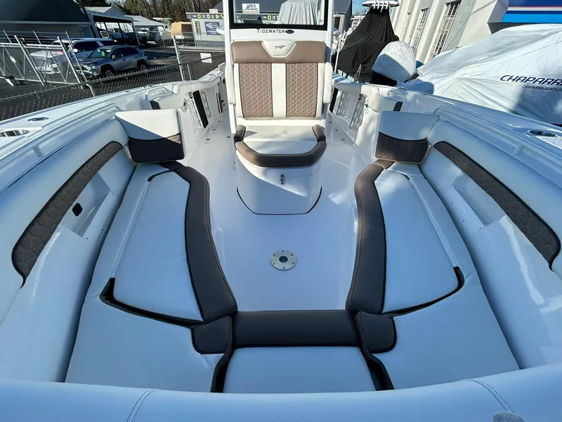Slide: The Image of 2025 Tidewater 256 LXF boat interior with cushioned seating and modern design. - 12