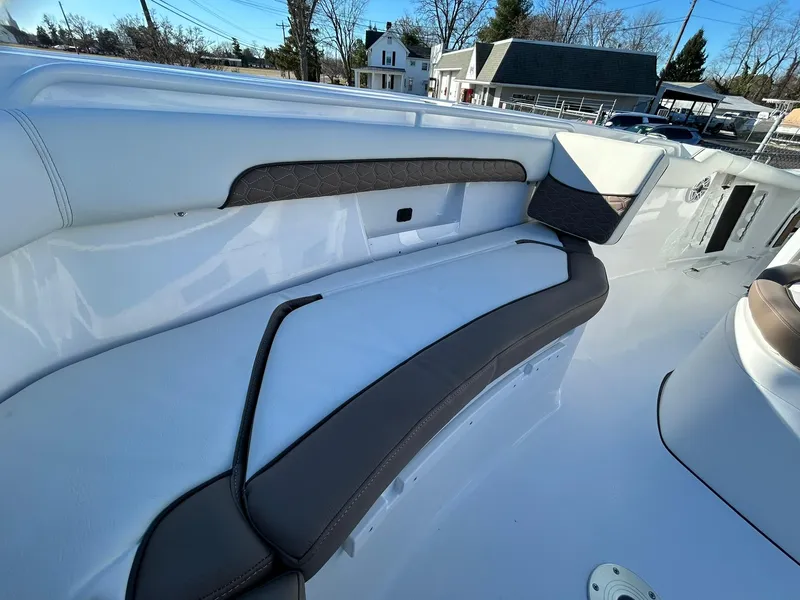 Slide: The Image of 2025 Tidewater 256 LXF boat interior with sleek seating and modern design. - 14