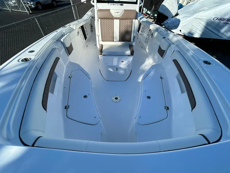 Slide: The Image of 2025 Tidewater 256 LXF boat interior with spacious seating and storage compartments. - 18