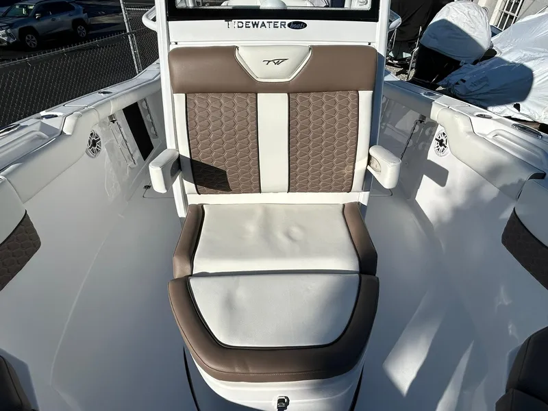 Slide: The Image of 2025 Tidewater 256 LXF boat seat with brown and white upholstery. - 21