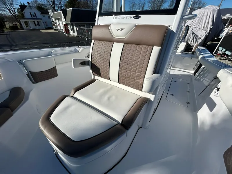 Slide: The Image of 2025 Tidewater 256 LXF boat seat with brown and white upholstery. - 22