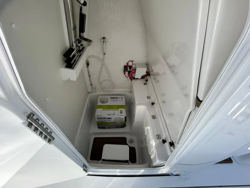 Slide: The Image of 2025 Tidewater 256 LXF boat interior with storage and equipment. - 33