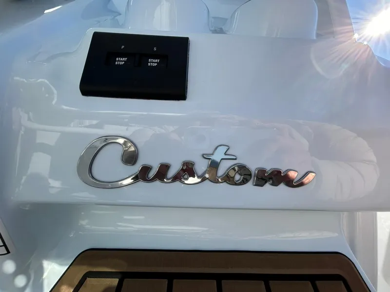 Slide: The Image of Tidewater 256 LXF 2025 boat with "Custom" emblem and start/stop buttons. - 40