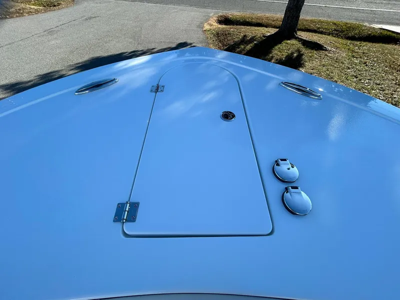 Slide: The Image of 2025 Tidewater 256 LXF boat deck with sleek design and hatch details. - 5