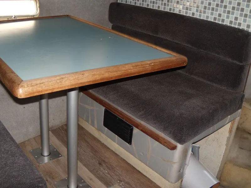 Slide: The Image of Interior seating and table of 1988 Bayliner 2655 Ciera Sunbridge boat. - 12