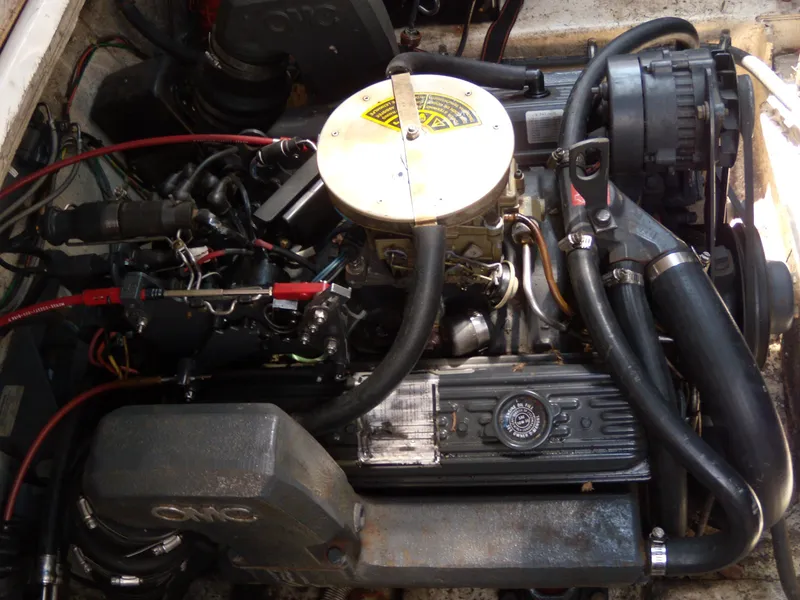 Slide: The Image of 1988 Bayliner 2655 Ciera Sunbridge engine compartment with visible components and wiring. - 4