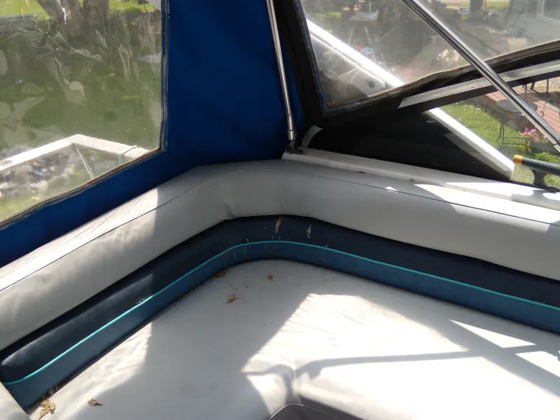 Slide: The Image of Interior seating of 1988 Bayliner 2655 Ciera Sunbridge boat with blue and white upholstery. - 5