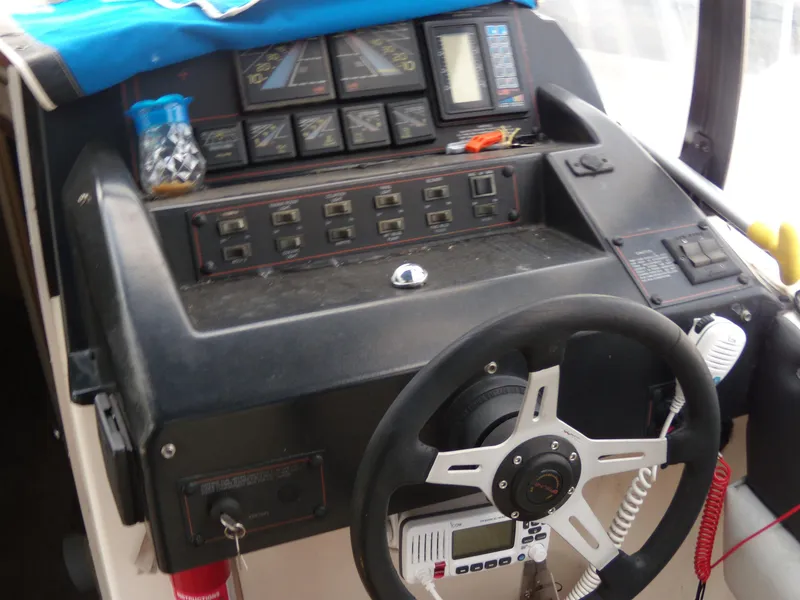 Slide: The Image of 1988 Bayliner 2655 Ciera Sunbridge dashboard with steering wheel and control panel. - 8