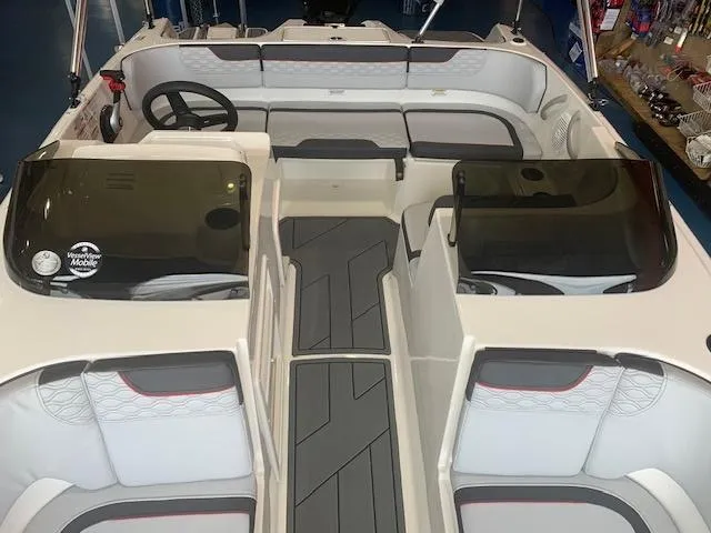 Slide: The Image of 2024 Bayliner Element M17 boat interior with seating and steering wheel. - 3