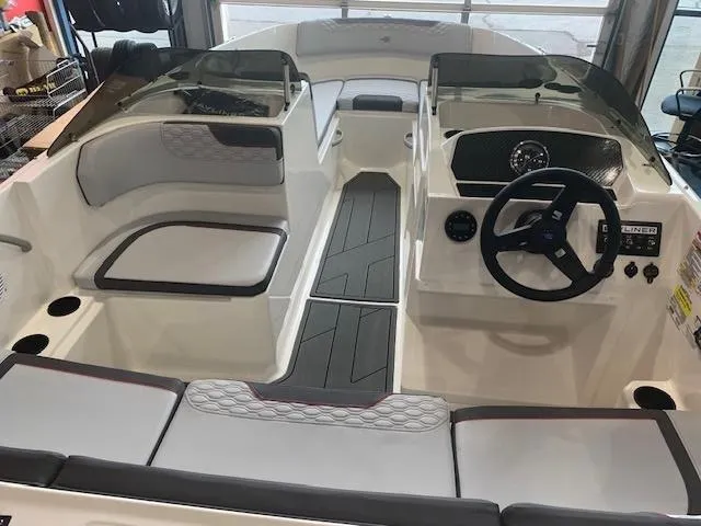 Slide: The Image of 2024 Bayliner Element M17 boat interior with seating and steering console. - 4
