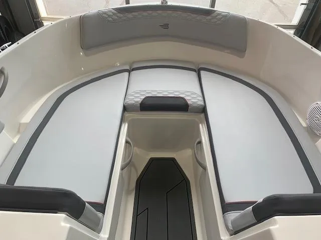 Slide: The Image of 2024 Bayliner Element M17 boat interior with cushioned seating. - 6