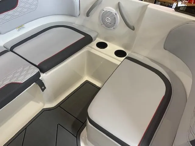 Slide: The Image of 2024 Bayliner Element M17 boat interior with cushioned seating and cup holders. - 8