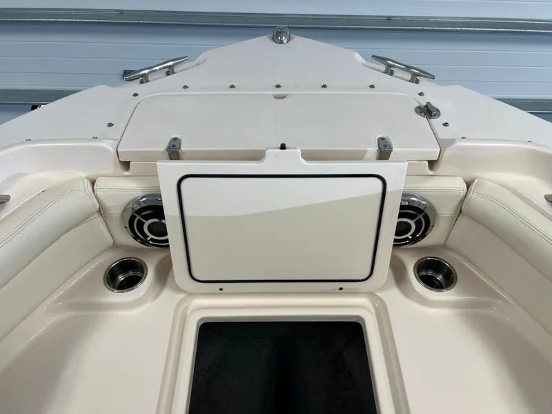 Slide: The Image of 2016 Grady-White Freedom 225 boat interior, bow seating area with storage compartment. - 12