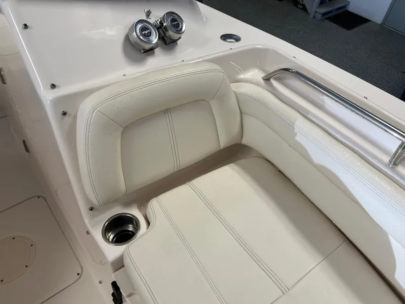 Slide: The Image of 2016 Grady-White Freedom 225 boat interior seating with cup holder and gauges. - 18