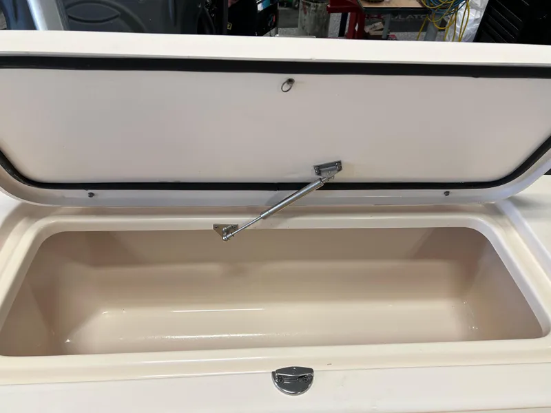 Slide: The Image of Open storage compartment on a 2016 Grady-White Freedom 225 boat. - 23