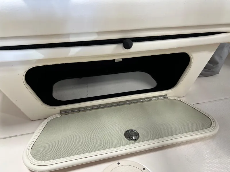 Slide: The Image of Open storage compartment on a 2016 Grady-White Freedom 225 boat. - 29