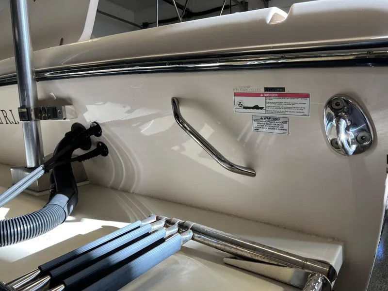 Slide: The Image of 2016 Grady-White Freedom 225 boat interior with safety warning labels. - 33
