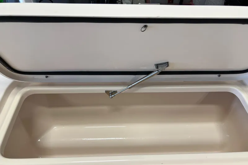 Slide: The Image of Open storage compartment on a 2016 Grady-White Freedom 225 boat. - 36