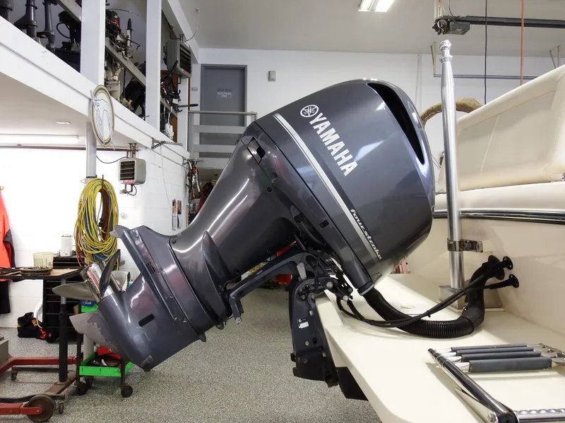 Slide: The Image of 2016 Grady-White Freedom 225 with Yamaha outboard motor in a workshop. - 47