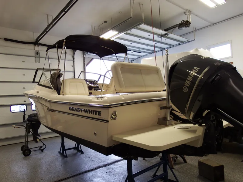 Slide: The Image of 2016 Grady-White Freedom 225 boat with Yamaha engine in a garage. - 48