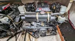 Slide: The Image of Engine compartment of a 2001 Maxum 3000SCR boat, featuring a 5.0L engine. - 10