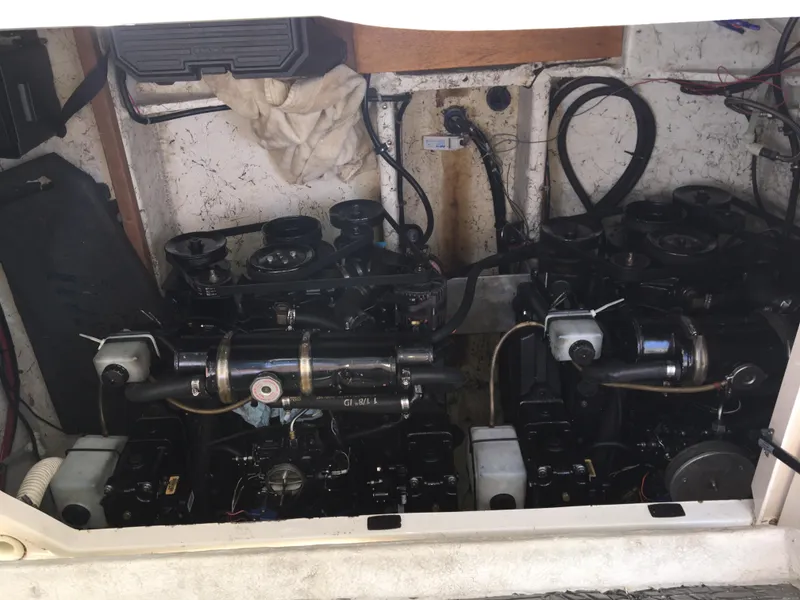 Slide: The Image of Engine compartment of a 2001 Maxum 3000SCR boat, showcasing dual engines and wiring. - 6