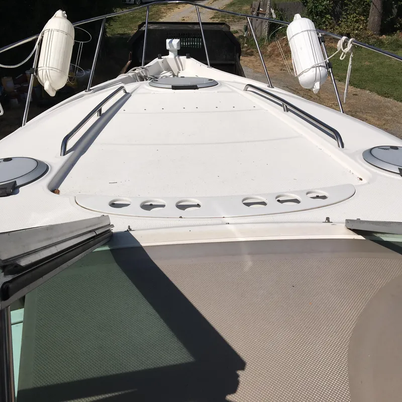 Slide: The Image of Maxum 2001 3000SCR boat deck with railings and fenders, viewed from the bow. - 8