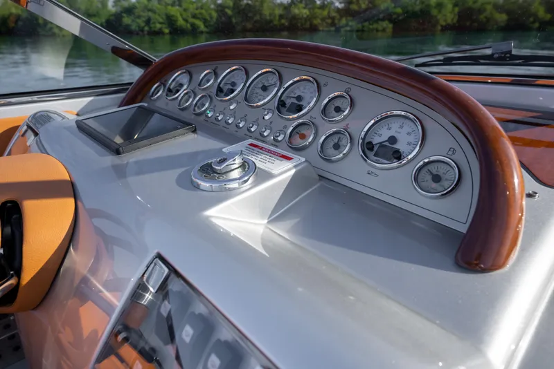 Slide: The Image of Dashboard of a 2020 Riva Aquariva boat with gauges and controls. - 21