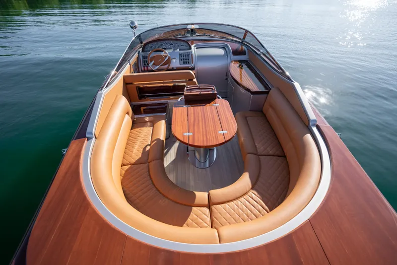 Slide: The Image of Luxurious 2020 Riva Aquariva boat with elegant wood and leather interior on calm water. - 22