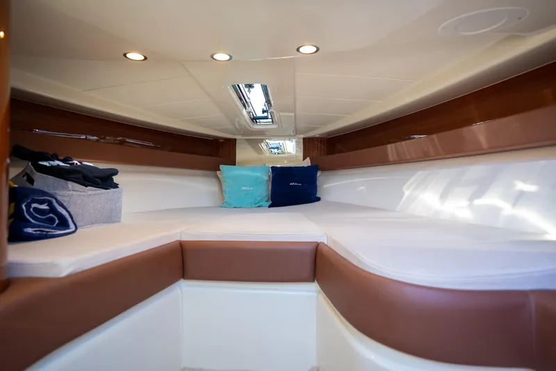 Slide: The Image of Interior cabin of a 2020 Riva Aquariva boat with cushions and overhead lighting. - 23