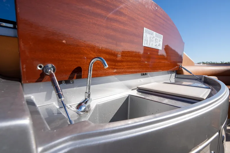 Slide: The Image of Riva Aquariva 2020 boat sink and faucet with wooden cover. - 24