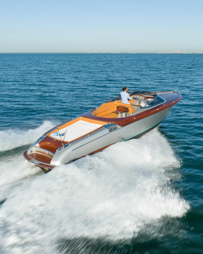 Slide: The Image of 2020 Riva Aquariva luxury speedboat cruising on open water. - 10