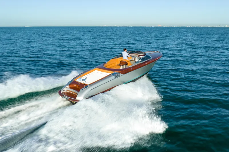 Slide: The Image of 2020 Riva Aquariva luxury speedboat cruising on open water. - 11