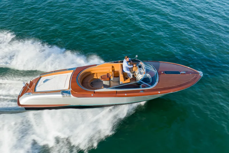 Slide: The Image of 2020 Riva Aquariva luxury speedboat cruising on open water. - 12
