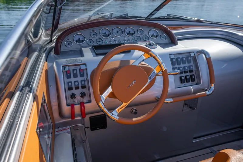 Slide: The Image of 2020 Riva Aquariva boat dashboard with steering wheel and control panel. - 20