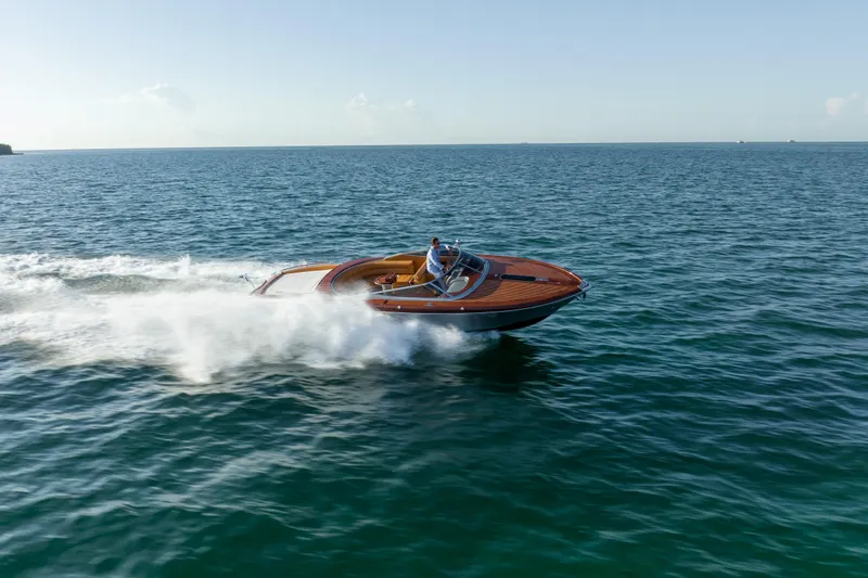 Slide: The Image of 2020 Riva Aquariva speedboat cruising on open water. - 6