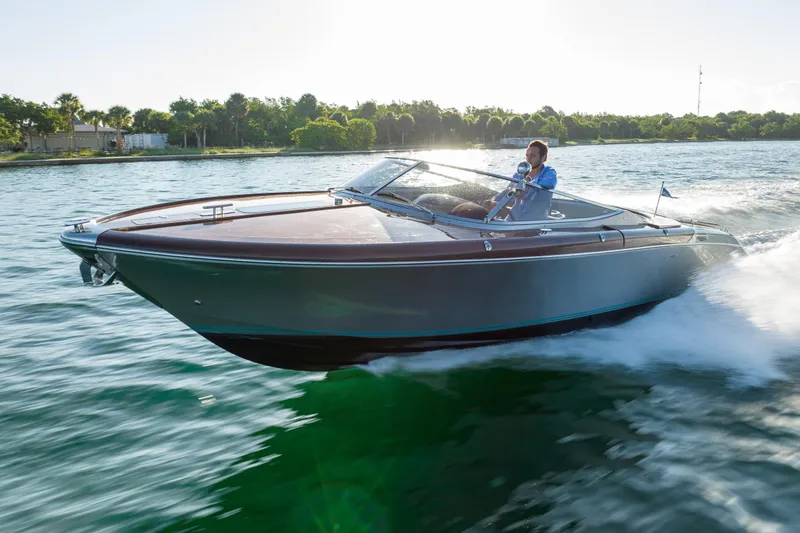 Slide: The Image of 2020 Riva Aquariva luxury speedboat cruising on a sunny day. - 7