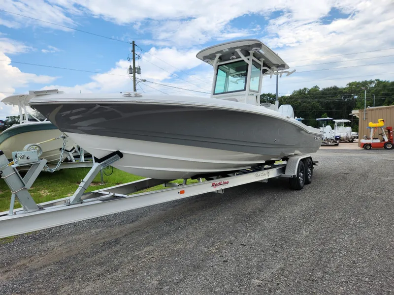 Slide: The Image of 2024 Caymas 28 HB boat on trailer, side view. - 13