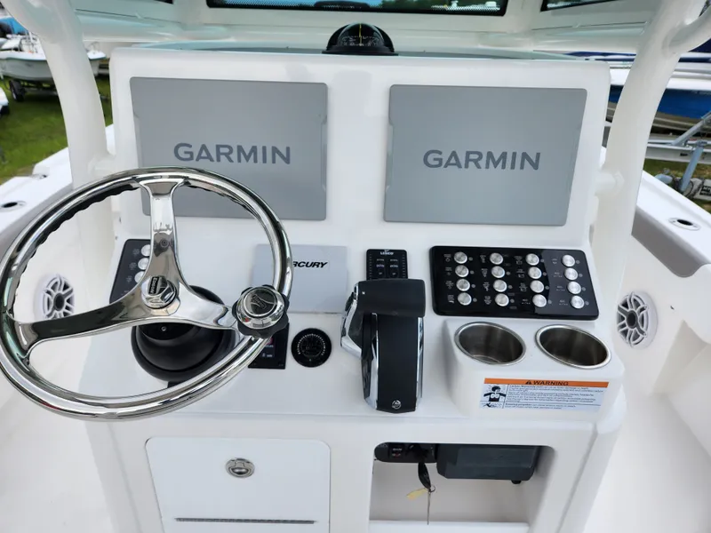 Slide: The Image of Caymas 28 HB 2024 helm with Garmin displays. - 4