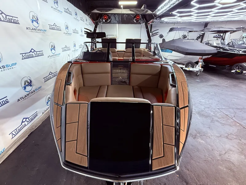 Slide: The Image of 2023 Moomba Mojo boat in showroom with luxurious interior. - 10
