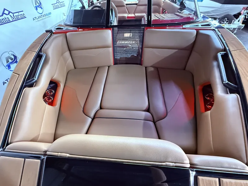 Slide: The Image of Interior of a 2023 Moomba Mojo boat with beige leather seating. - 11