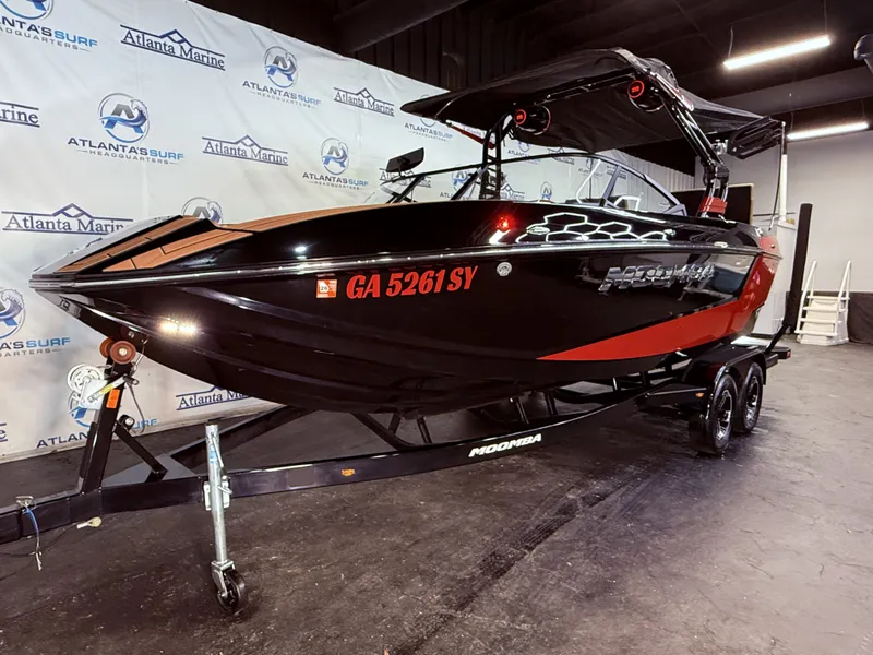 Slide: The Image of 2023 Moomba Mojo boat on trailer in showroom. - 12