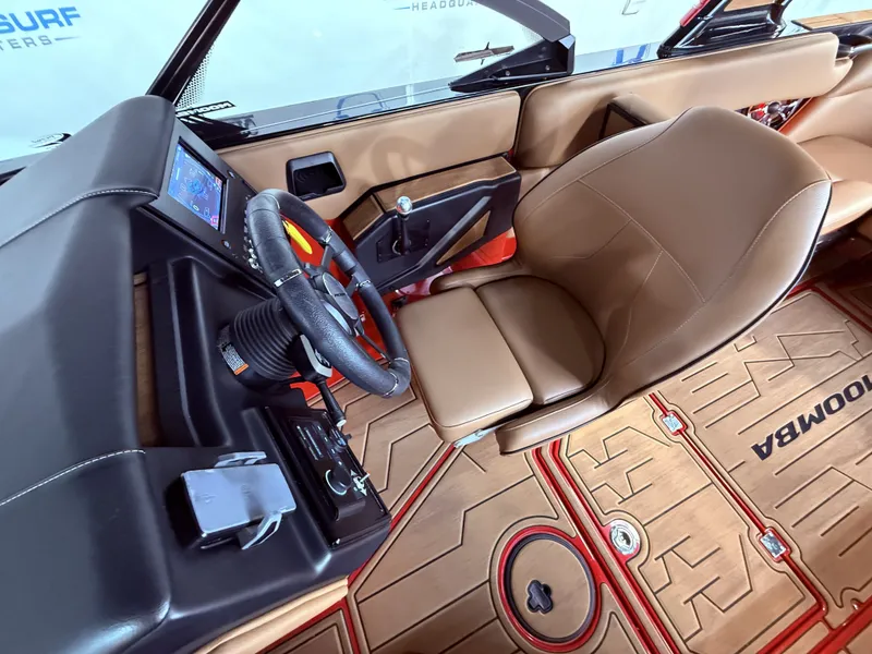 Slide: The Image of 2023 Moomba Mojo interior with steering wheel and display. - 29