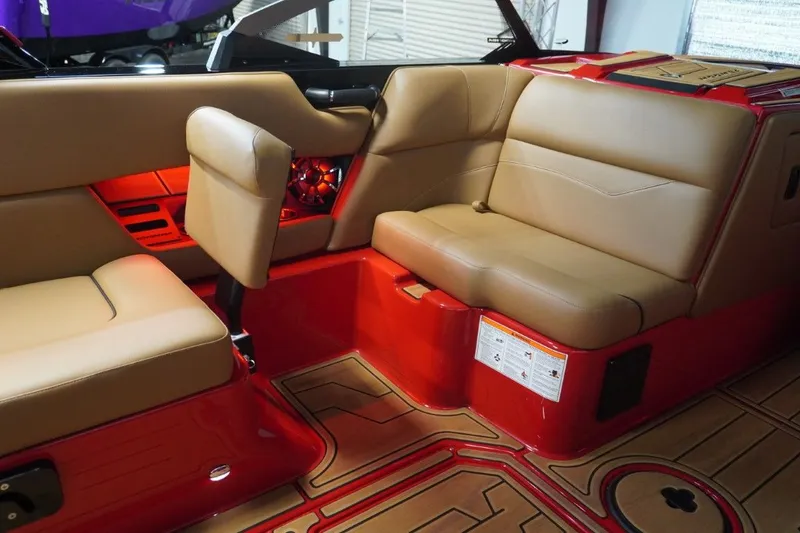 Slide: The Image of Interior of a 2023 Moomba Mojo boat with red accents. - 35