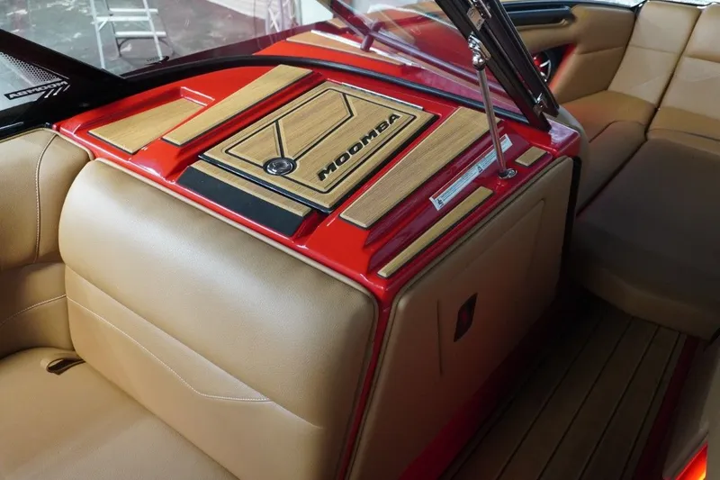 Slide: The Image of Interior of a 2023 Moomba Mojo boat with red and beige accents. - 39