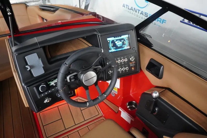 Slide: The Image of Interior of 2023 Moomba Mojo boat with modern control console. - 44