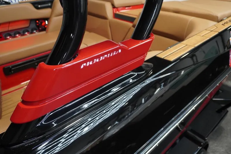 Slide: The Image of Close-up of 2023 Moomba Mojo boat with red and black design. - 48