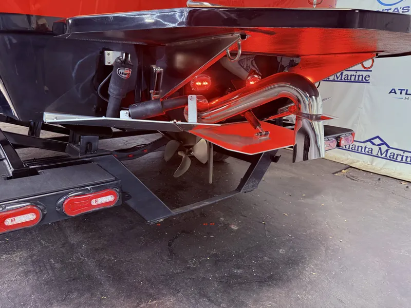 Slide: The Image of Rear view of a 2023 Moomba Mojo boat with propeller and exhaust. - 6