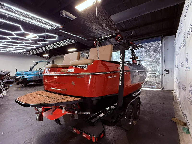 Slide: The Image of 2023 Moomba Mojo boat in a showroom. - 7