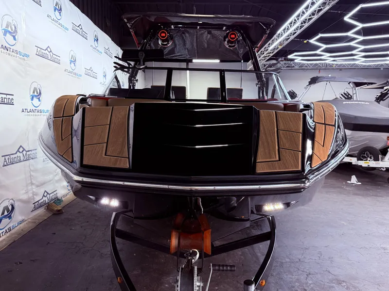 Slide: The Image of 2023 Moomba Mojo boat in showroom with modern features. - 9